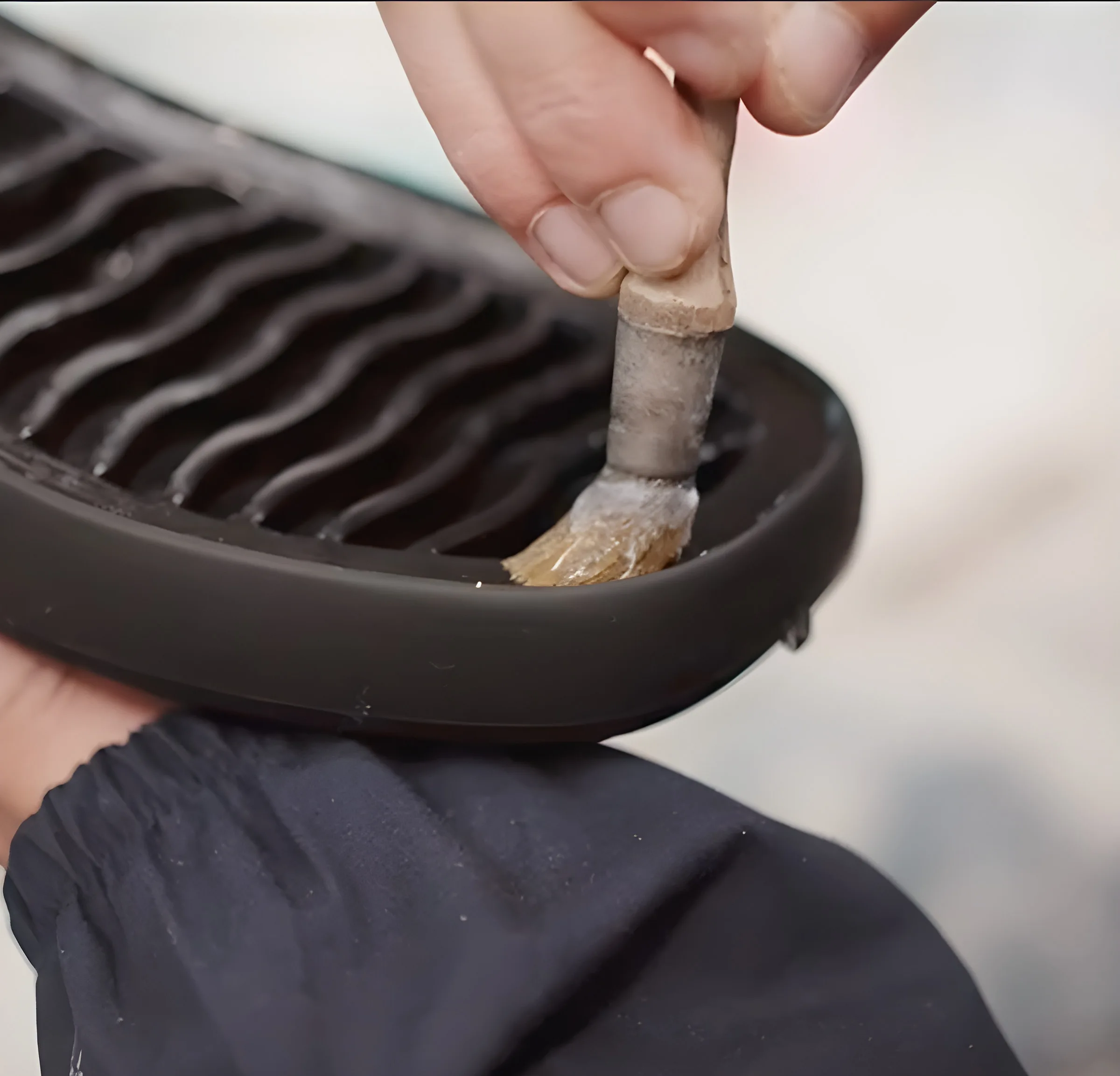 Brushing adhesive onto a sole